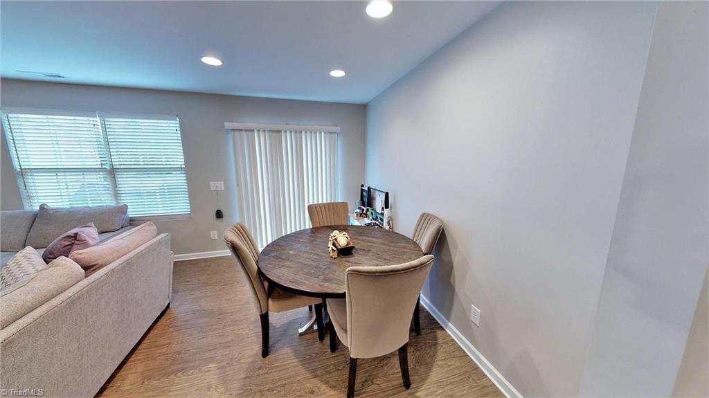 3885 Copperfield Court High Point, NC 27282 - Photo 12 of 30 Dining area with recessed lighting, doors lead to the patio area