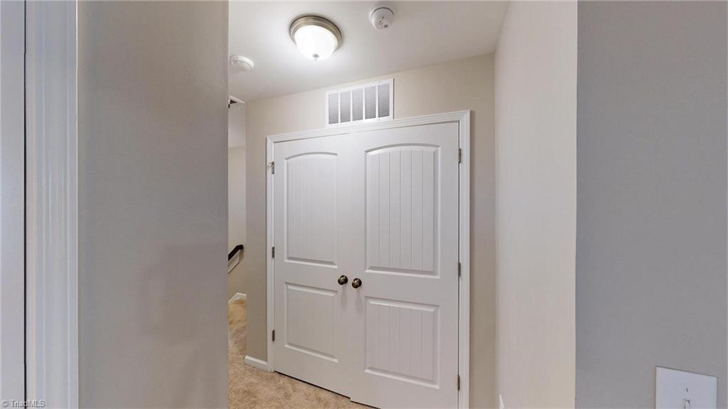 3885 Copperfield Court High Point, NC 27282 - Photo 18 of 30 Double doors to the laundry room...hallway upstairs