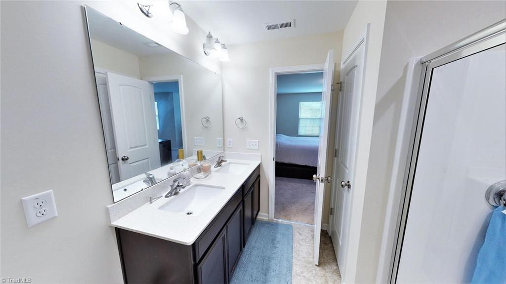 3885 Copperfield Court High Point, NC 27282 - Photo 22 of 30 Primary Bath had double sinks and a large shower.....there is also a large walk on closet about 6 X 8