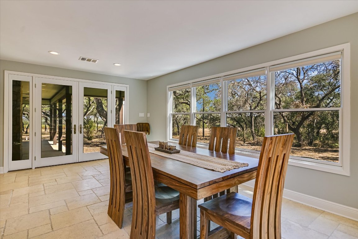 878 Ranch Road 2766 Johnson City, TX 78636 - Photo 11 of 40 a view of a dining room with furniture window and outside view