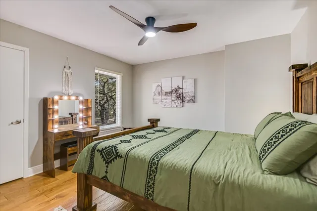 a bedroom with a bed and a table in it