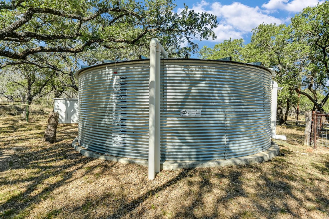 878 Ranch Road 2766 Johnson City, TX 78636 - Photo 23 of 40 a view of wooden door and a tree