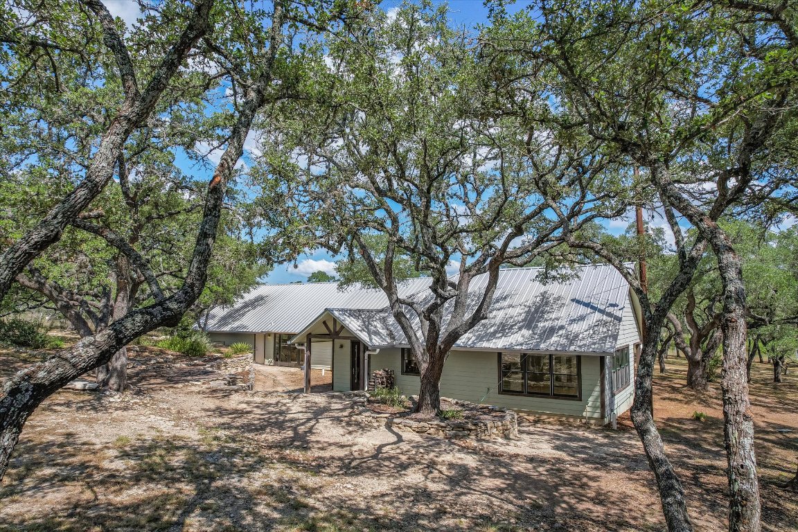 878 Ranch Road 2766 Johnson City, TX 78636 - Photo 39 of 40 a view of a house with a yard