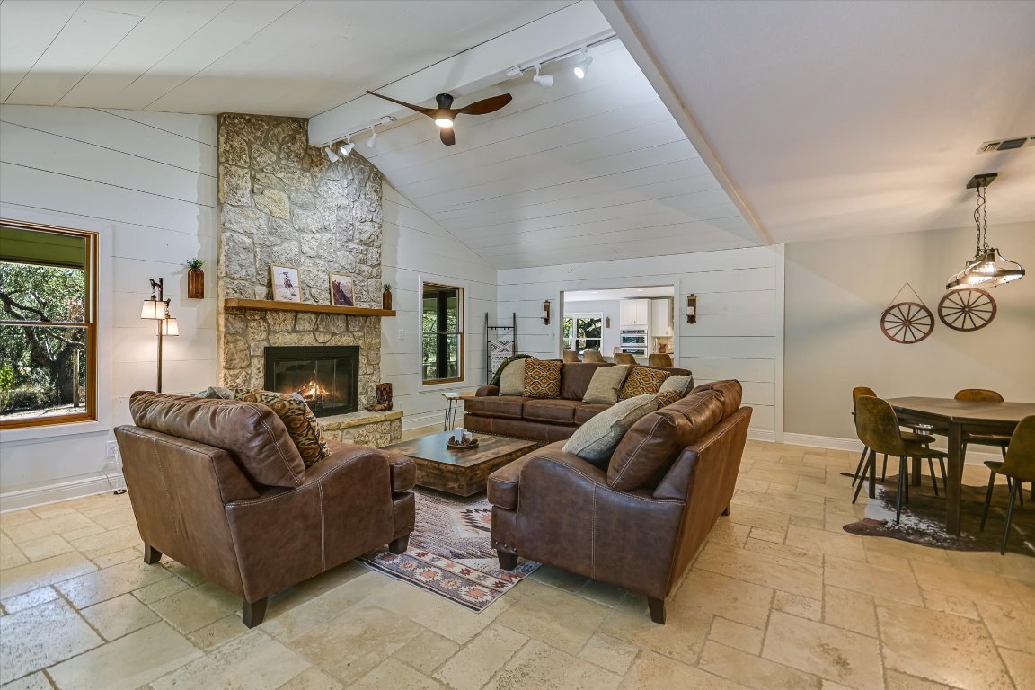 878 Ranch Road 2766 Johnson City, TX 78636 - Photo 8 of 40 a living room with furniture and a fireplace