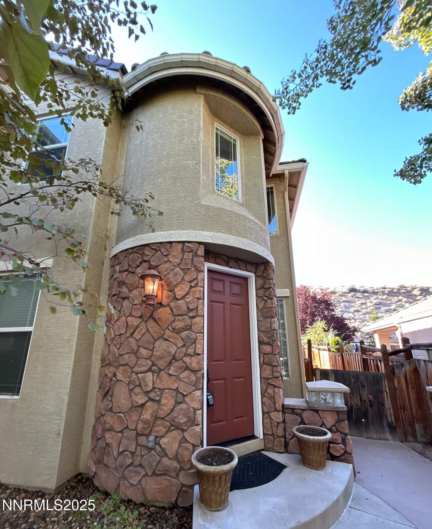2929 Astronomer Way Sparks, NV 89436 - Photo 2 of 11 a front view of a house with patio