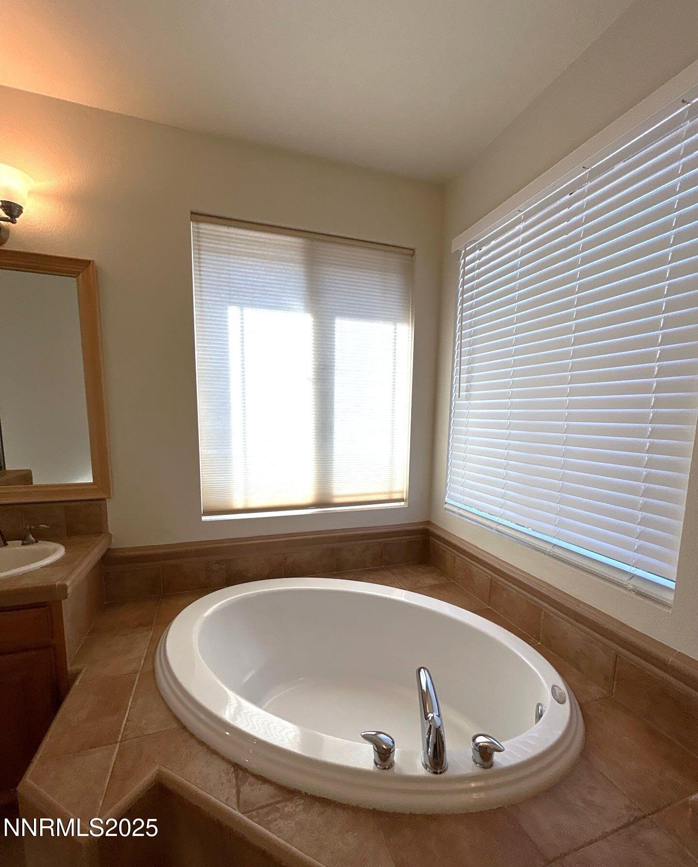 2929 Astronomer Way Sparks, NV 89436 - Photo 8 of 11 a bathroom with a bathtub and a window