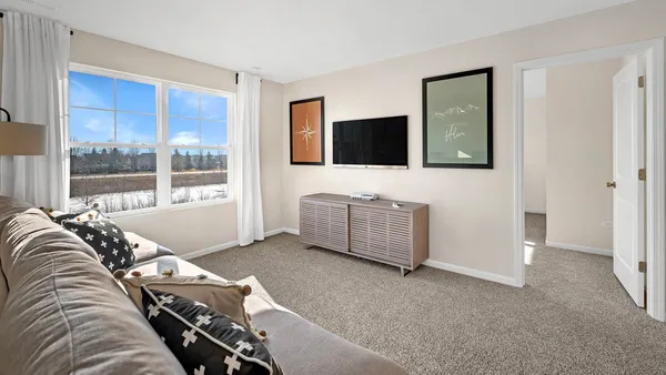 a living room with a couch and a flat screen tv