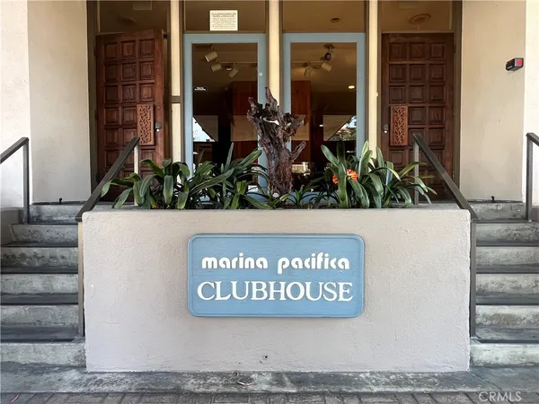 a view of front door and potted plants