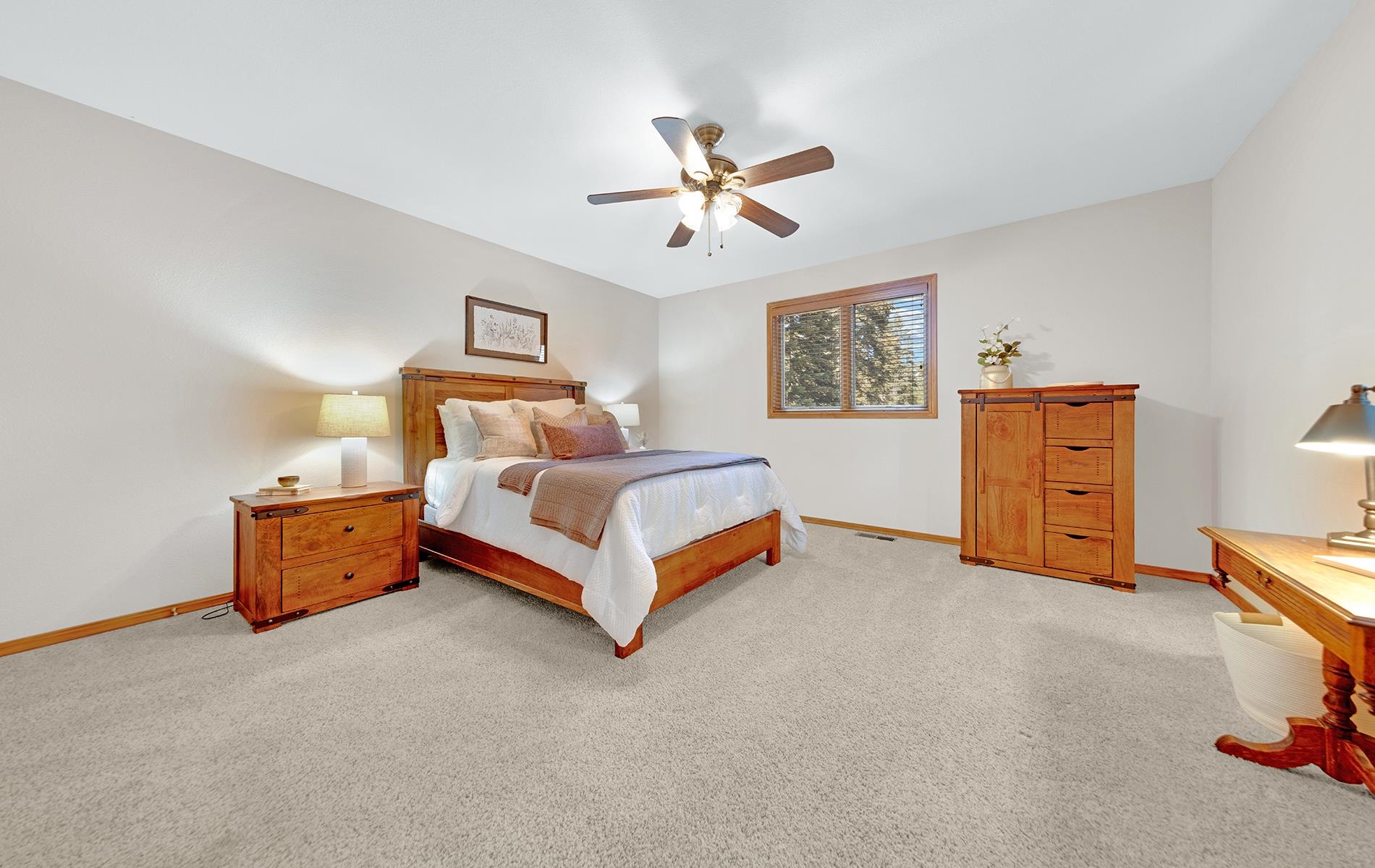 627 Deep Forest Road Lake Almanor, CA 96137 - Photo 13 of 29 a bed room with a bed and a ceiling fan