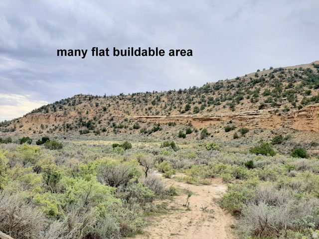 3366 North Thompson Cyn Road Green River, UT 84525 - Photo 4 of 18 Expansive land parcel featuring a flat, open field and rolling hills.