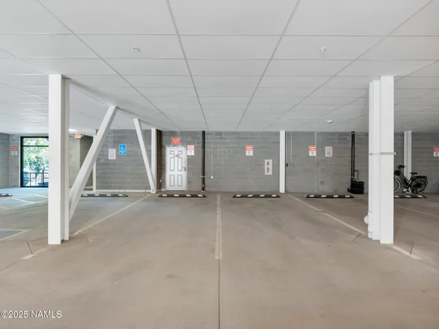 an aerial view of a house with outdoor seating