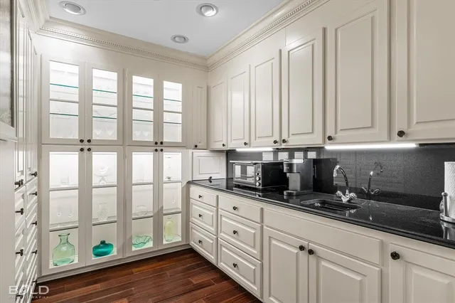 a kitchen with stainless steel appliances a sink and a window
