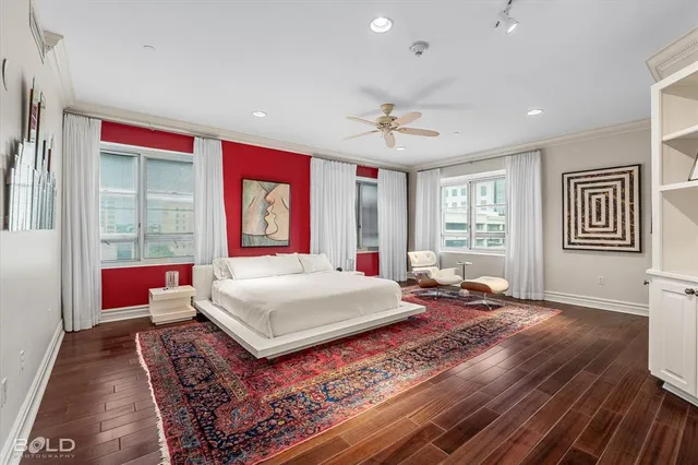 a living room with a large bed and a window
