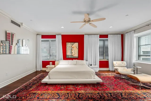 a bedroom with a bed furniture and a window