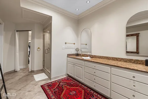 a bathroom with a glass shower door