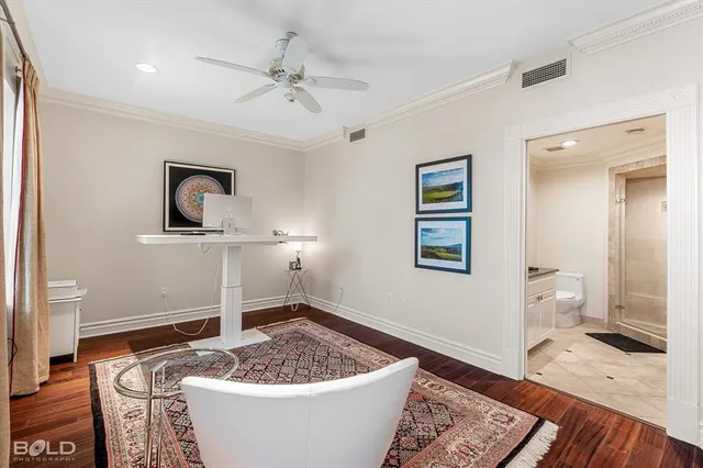 a bathroom with a granite countertop sink a toilet and a shower