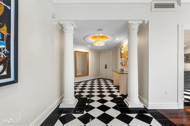 a bathroom with a black and white checkered floor