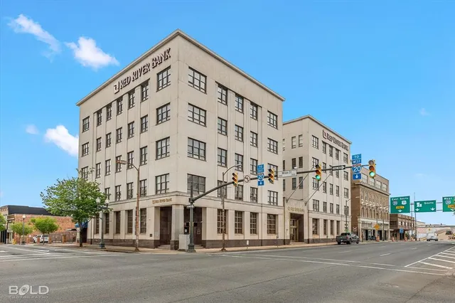 a tall building sitting on the side of a street