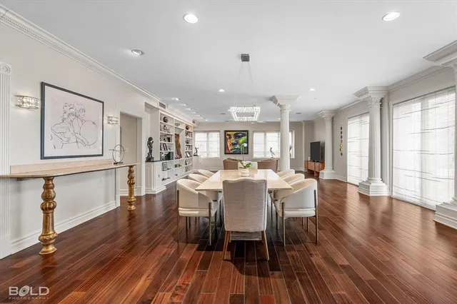 a view of a dining room with furniture and wooden floor