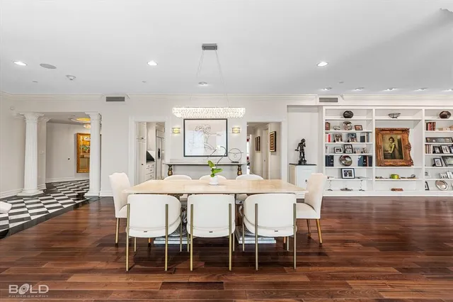 a large kitchen with a table and chairs