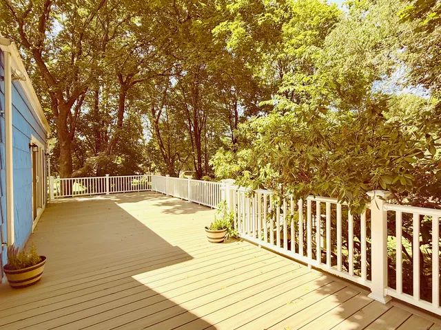 a view of a swimming pool with an outdoor space and seating area