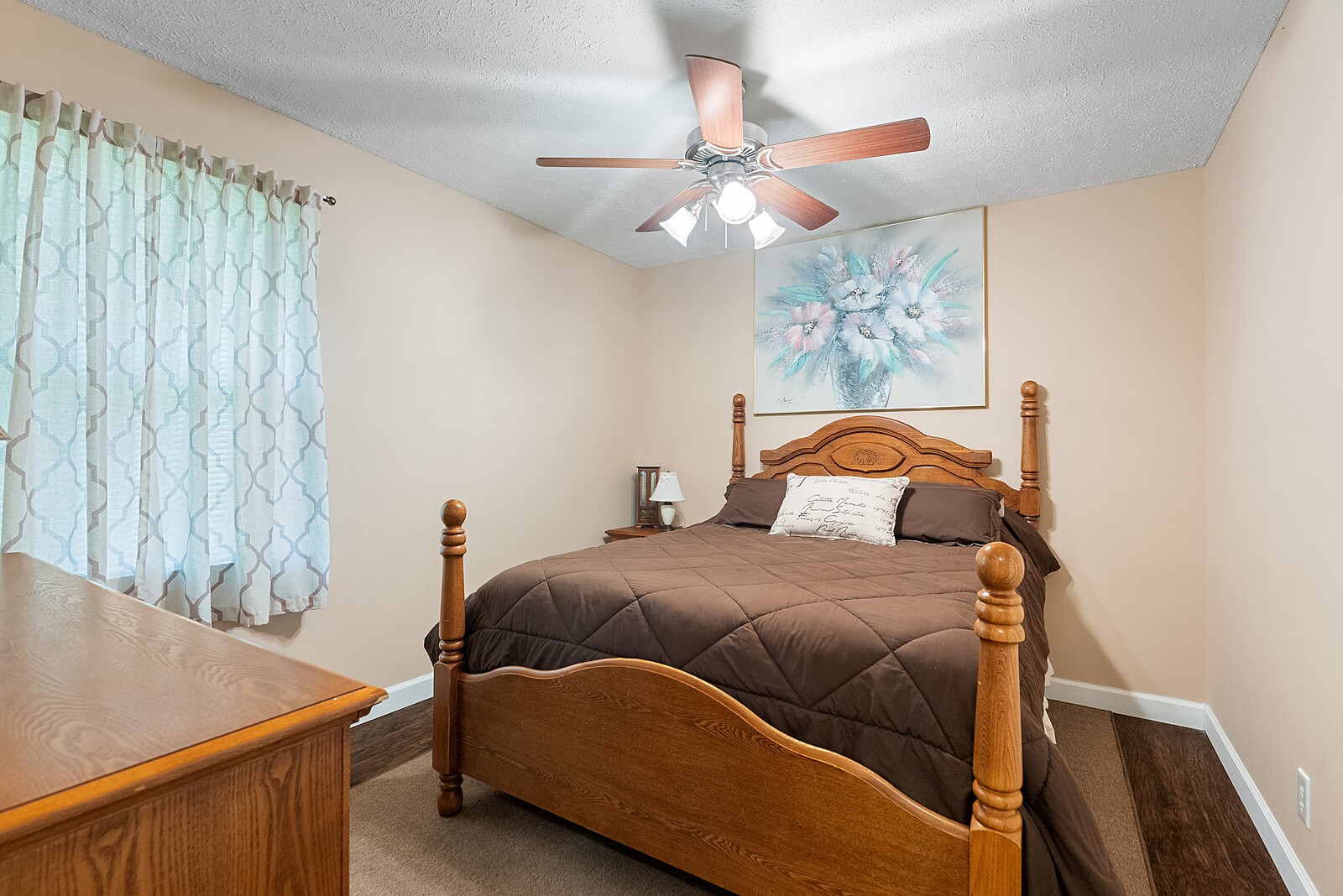 6614 Highway 49 Springfield, TN 37172 - Photo 14 of 19 a bedroom with a bed and a chandelier