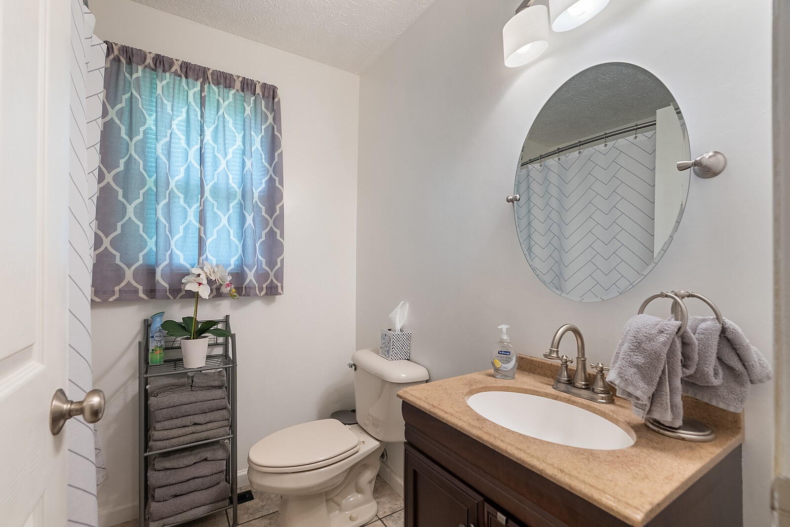 6614 Highway 49 Springfield, TN 37172 - Photo 15 of 19 a bathroom with a toilet a sink and mirror