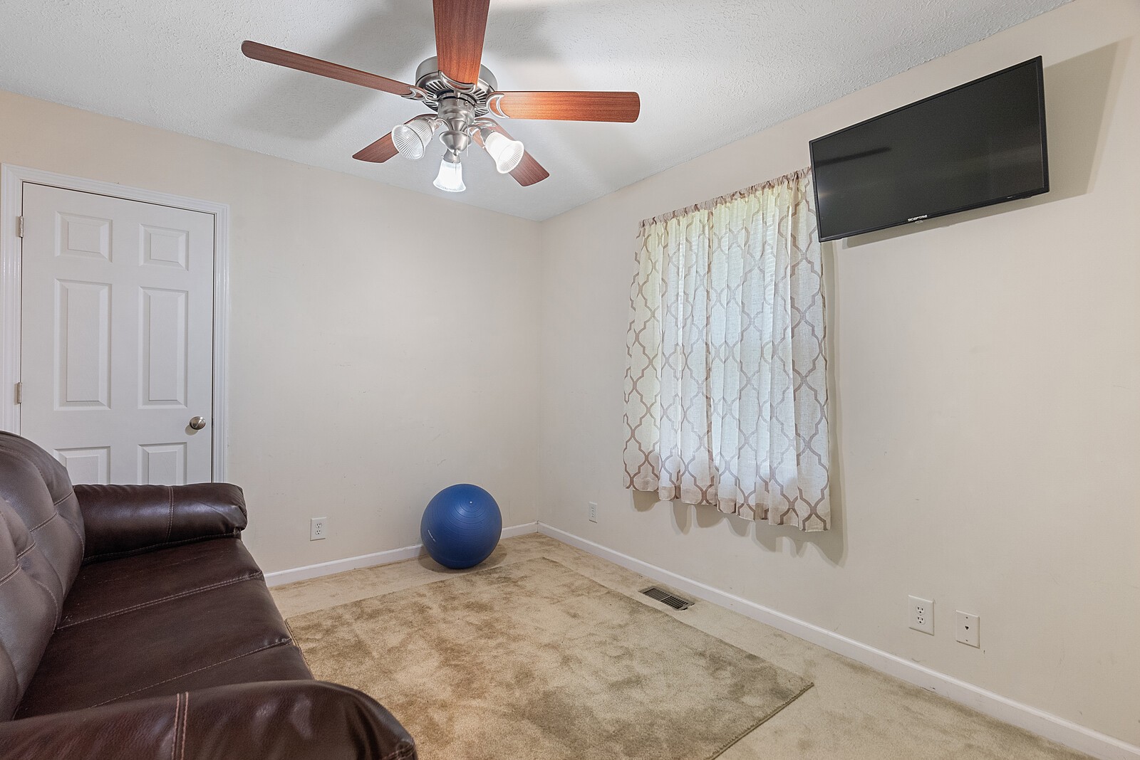 6614 Highway 49 Springfield, TN 37172 - Photo 16 of 19 a bedroom with a bed and a chandelier