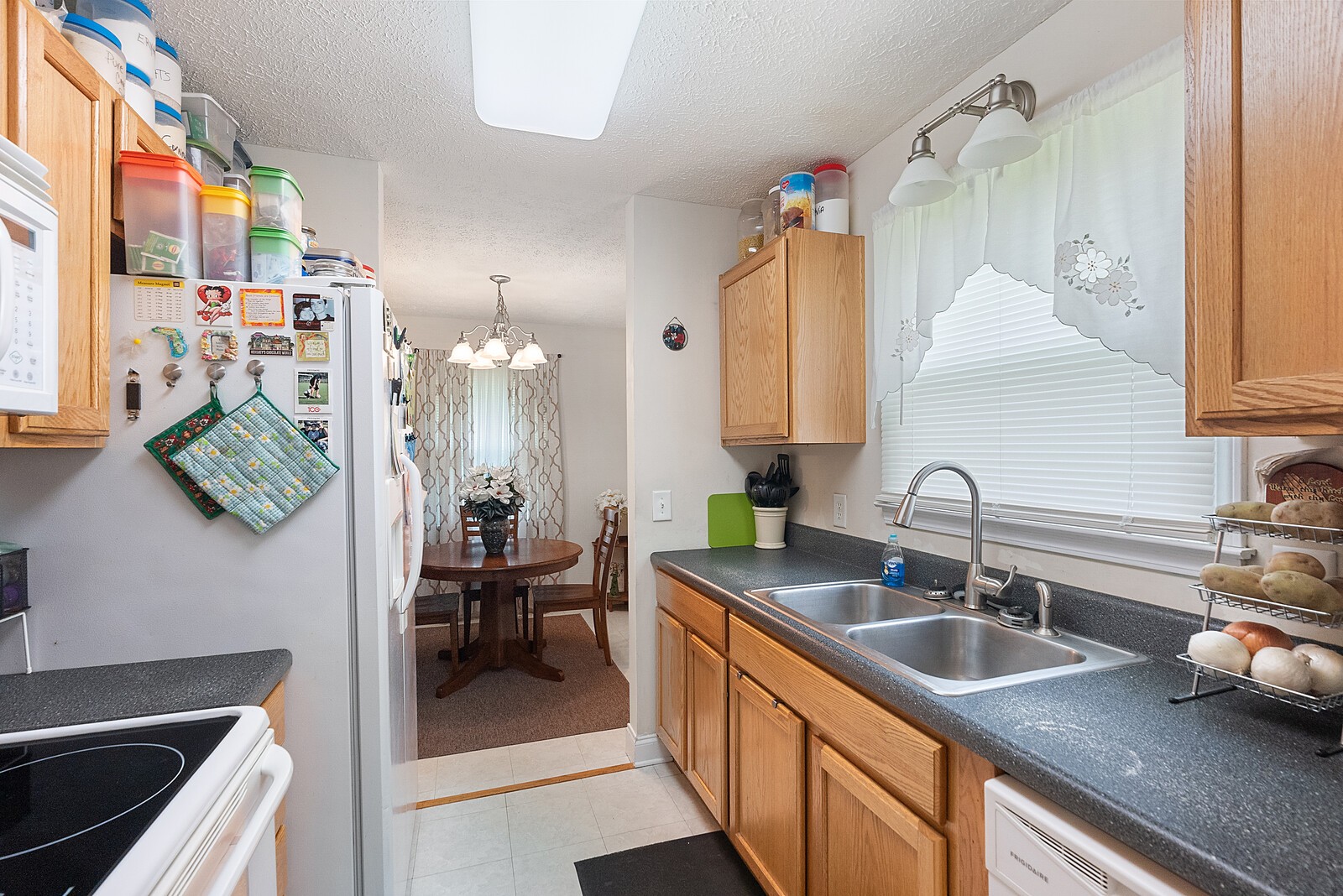 6614 Highway 49 Springfield, TN 37172 - Photo 10 of 19 a kitchen with a sink stove and cabinets