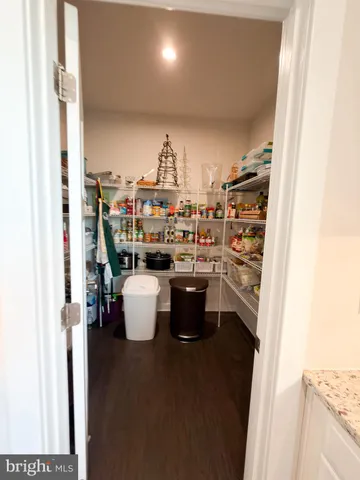 a spacious bedroom with a bed and a couch