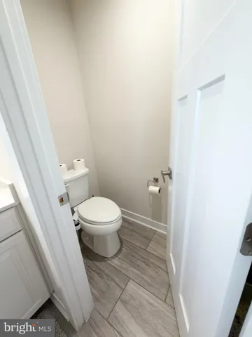 a view of a livingroom with workspace and a couch