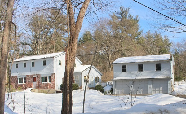 198 Proctor Road Chelmsford, MA 01824 - Photo 1 of 30 a front view of a house with garage