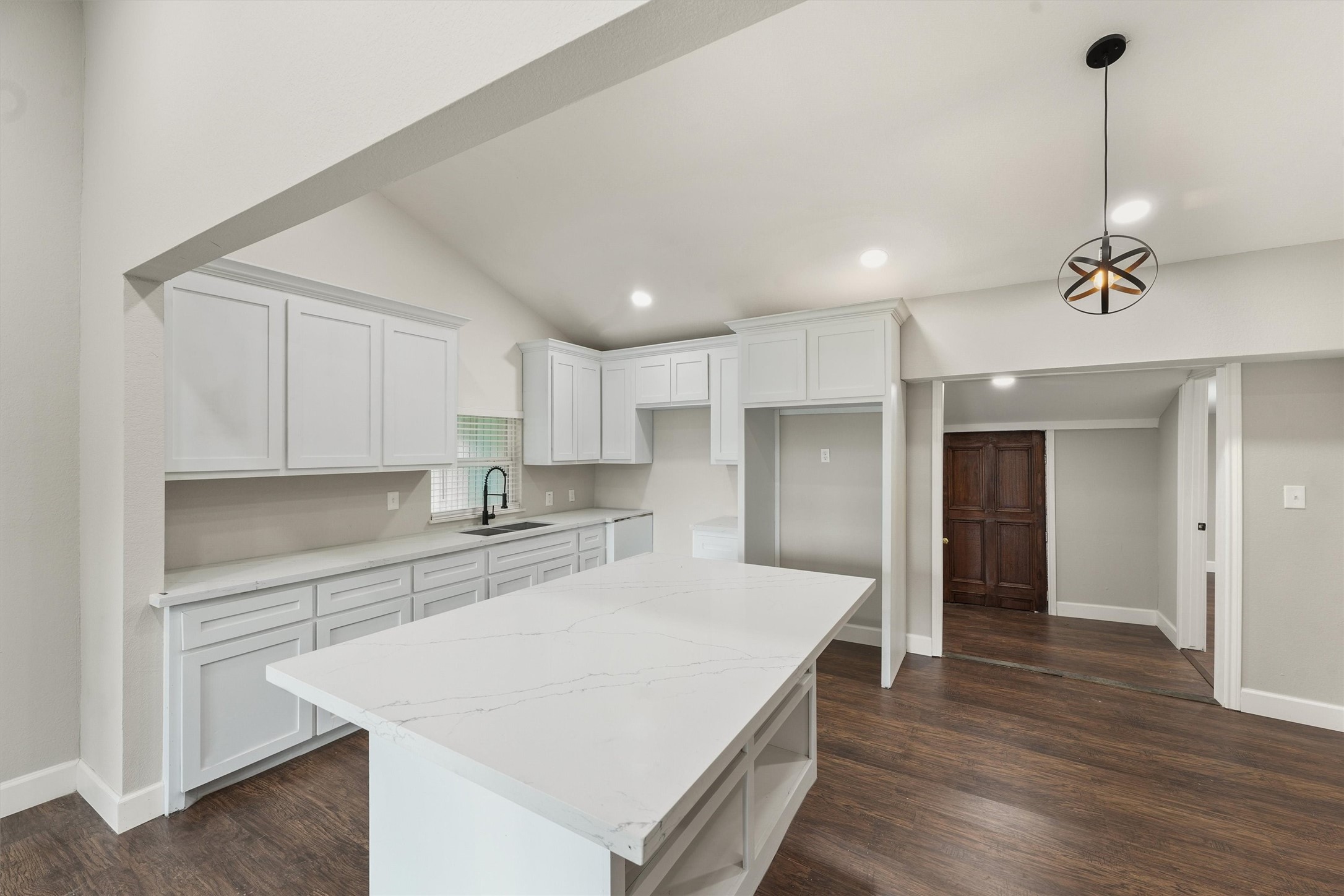 905 Franconia Drive Conroe, TX 77316 - Photo 4 of 12 a kitchen with kitchen island a sink stainless steel appliances and cabinets