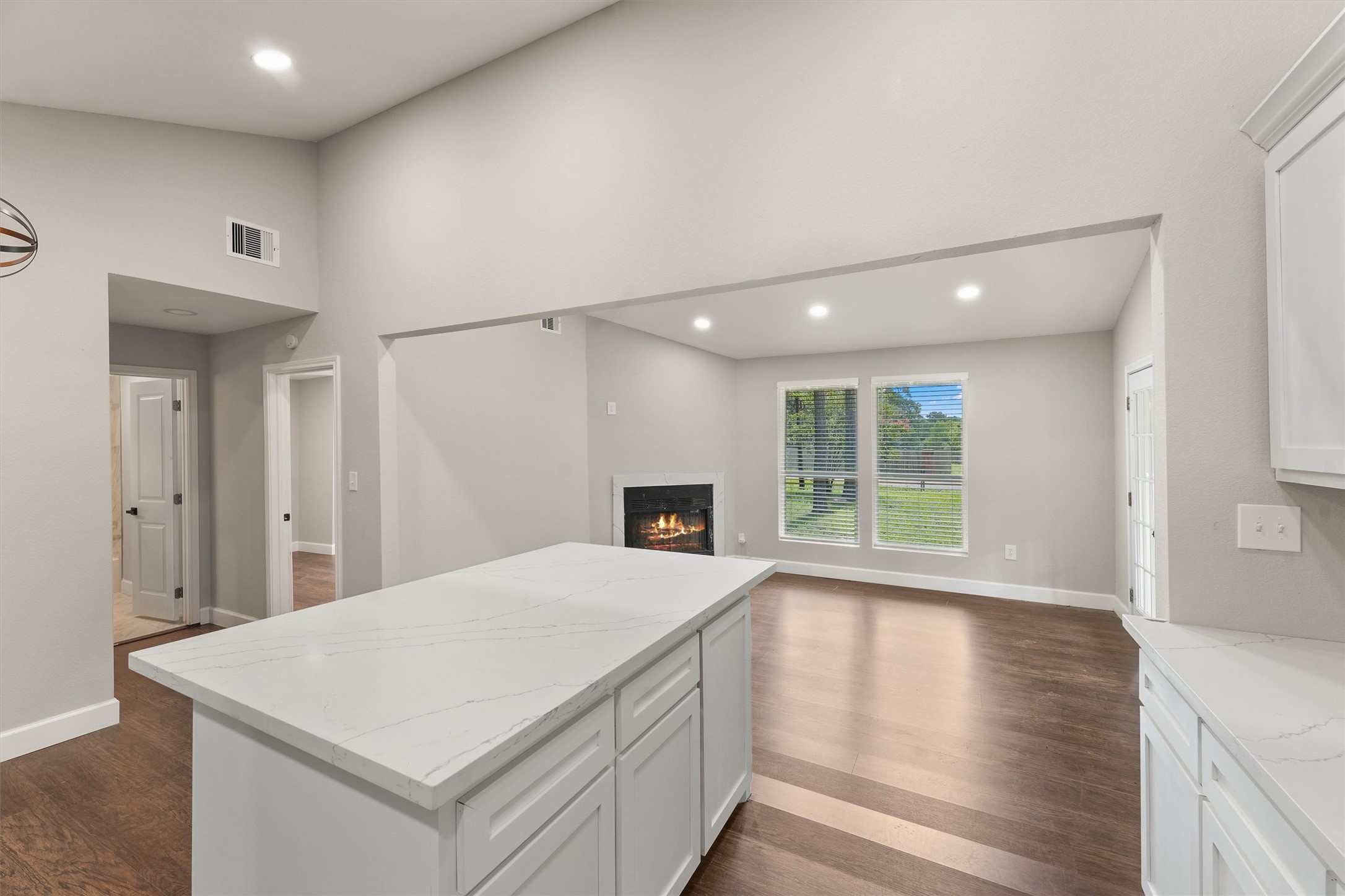 905 Franconia Drive Conroe, TX 77316 - Photo 6 of 12 a view of a kitchen with a fridge and wooden floor