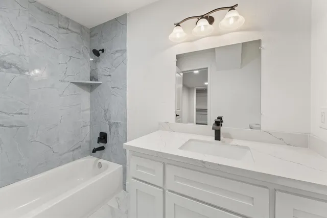 an empty room with wooden floor and window