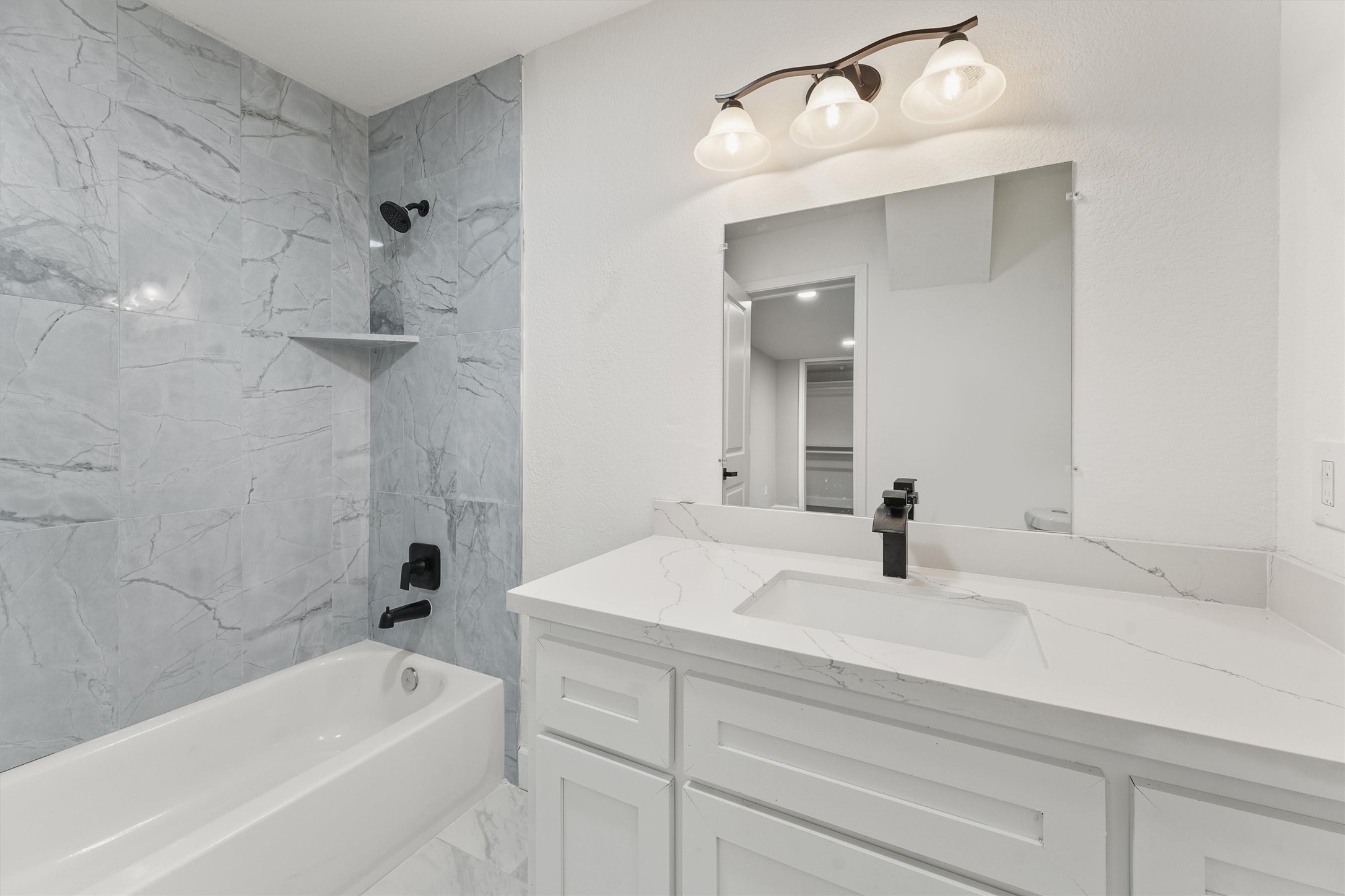 905 Franconia Drive Conroe, TX 77316 - Photo 7 of 12 a bathroom with a sink and a bathtub