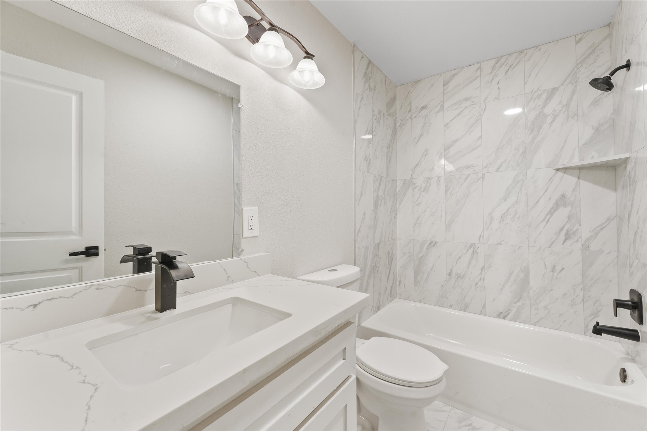 905 Franconia Drive Conroe, TX 77316 - Photo 10 of 12 a bathroom with a sink a toilet and a bathtub