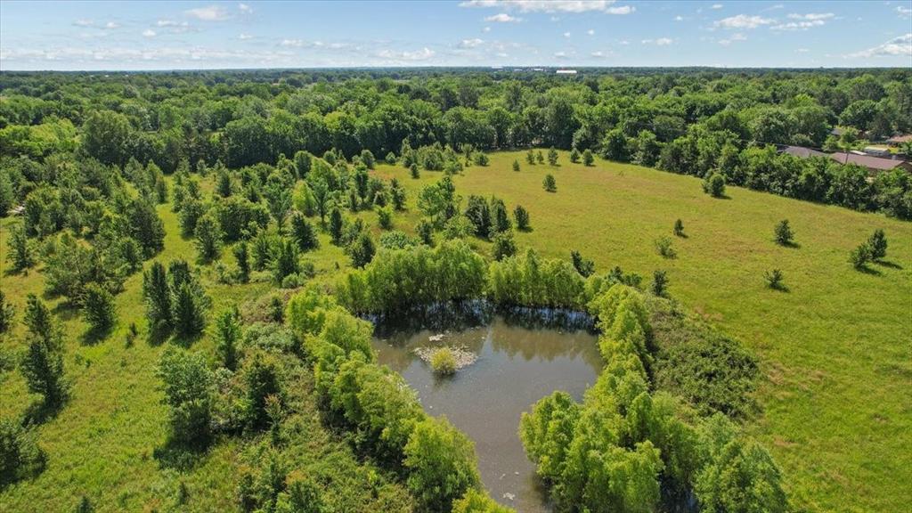 801 Jefferson Road Paris, TX 75460 - Photo 13 of 20 a view of a lake with a yard