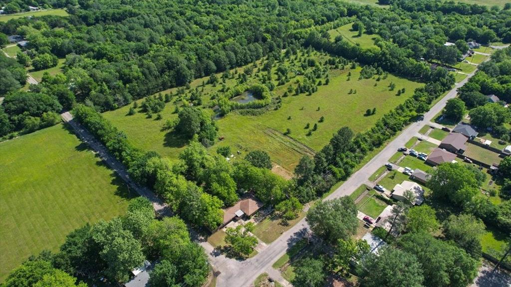 801 Jefferson Road Paris, TX 75460 - Photo 6 of 20 an aerial view of a residential houses with outdoor space and trees all around