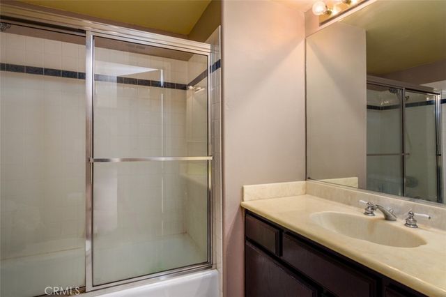 a front view of a building with a garden