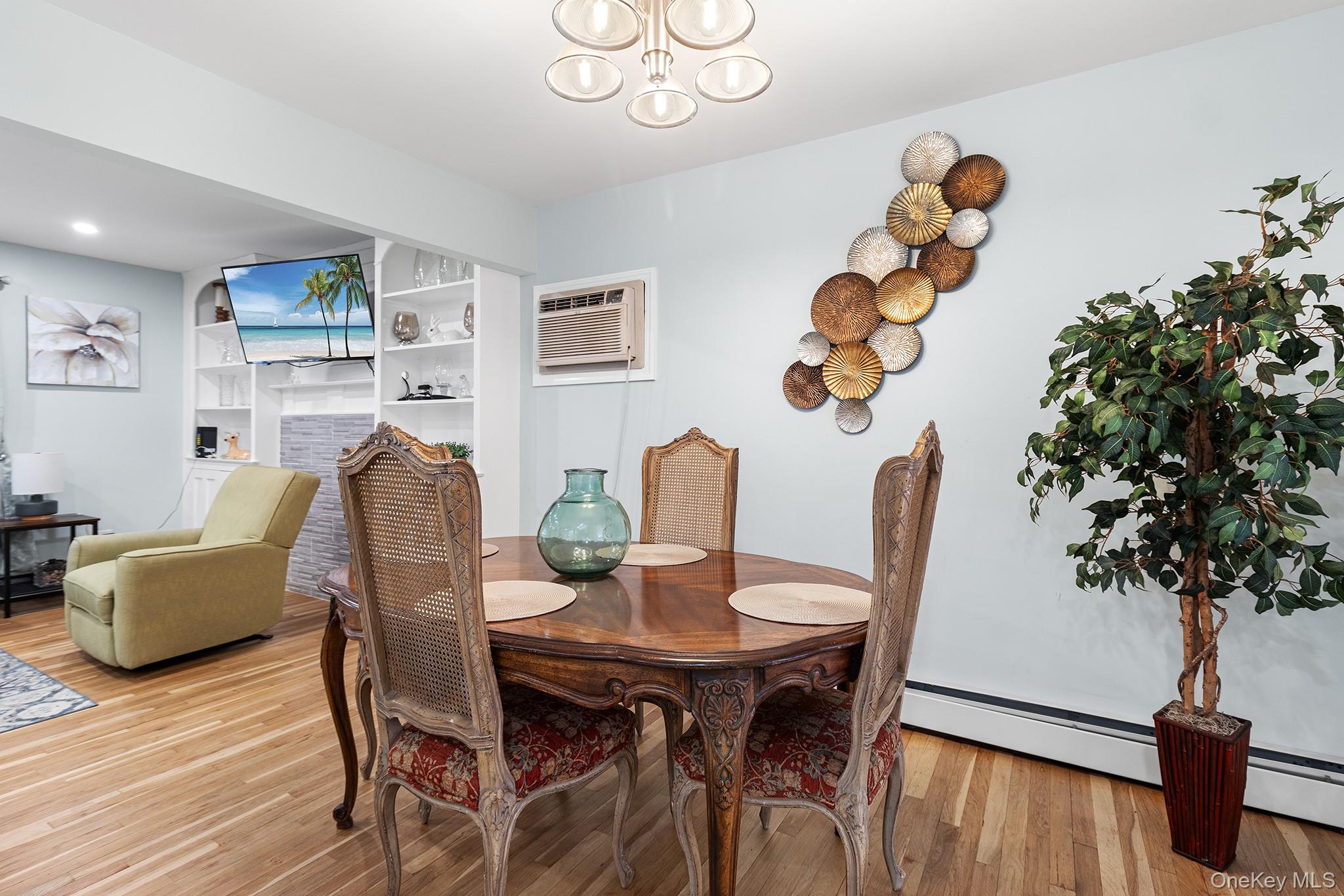 164 Colonial Springs Road Wheatley Heights, NY 11798 - Photo 12 of 35 a view of a dining room with furniture and wooden floor