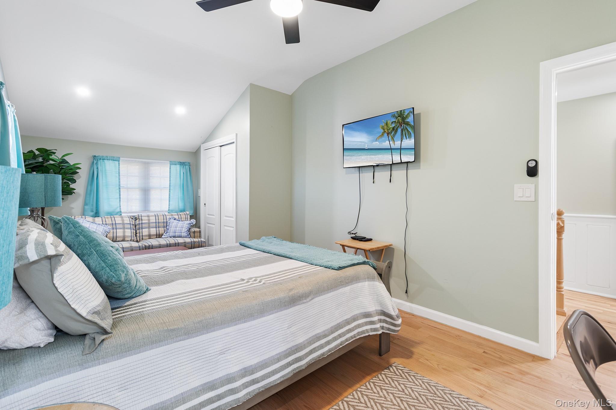 164 Colonial Springs Road Wheatley Heights, NY 11798 - Photo 26 of 35 a bedroom with a bed and a chandelier