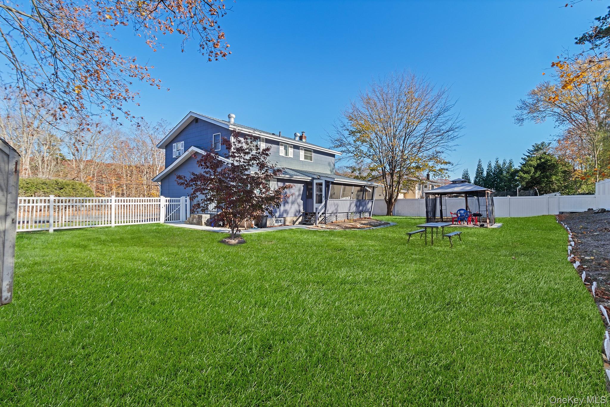 164 Colonial Springs Road Wheatley Heights, NY 11798 - Photo 35 of 35 a view of a house with a yard