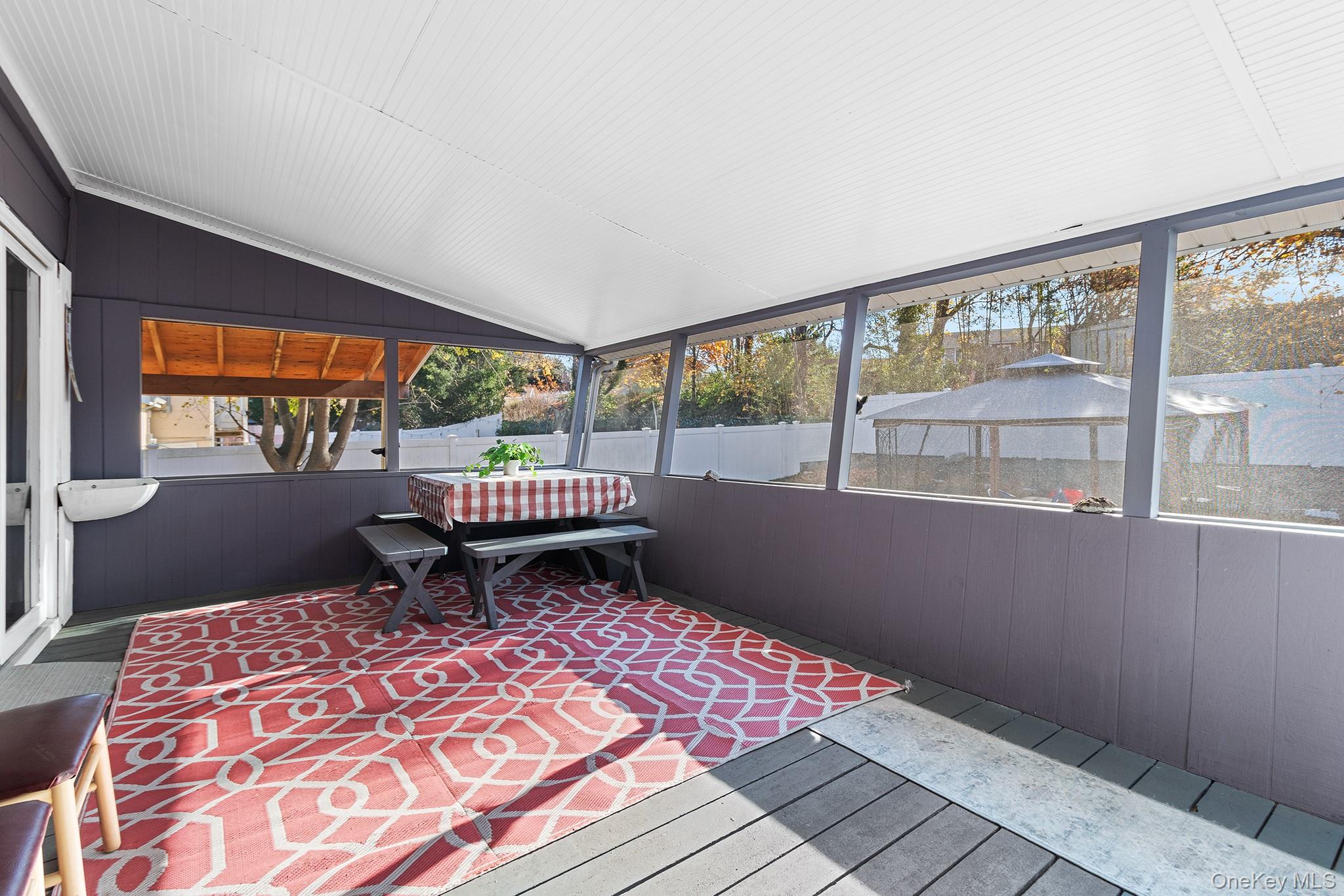 164 Colonial Springs Road Wheatley Heights, NY 11798 - Photo 5 of 35 a room with a balcony a bed and furniture