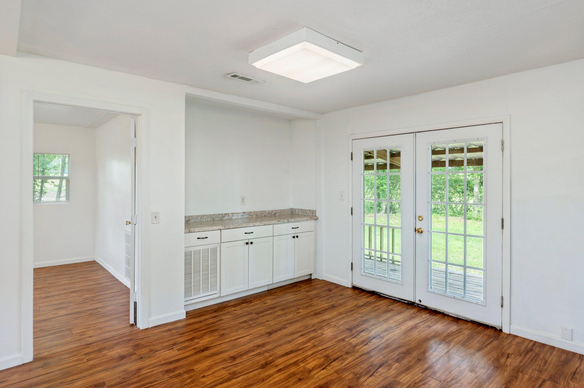 1099 Highway 2 Westville, FL 32464 - Photo 11 of 34 a view of a room with wooden floor and a window