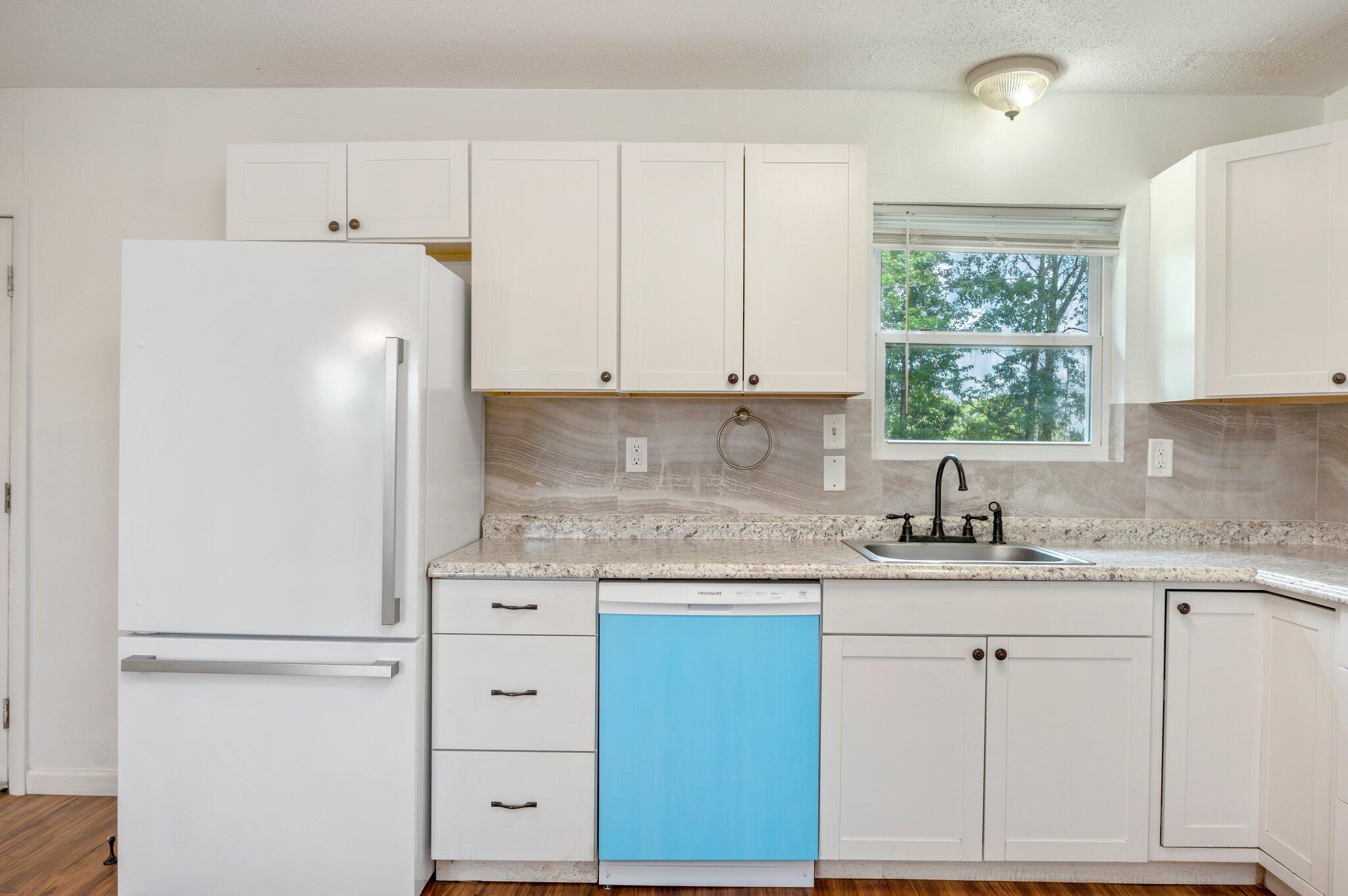 1099 Highway 2 Westville, FL 32464 - Photo 13 of 34 a kitchen with appliances cabinets and a sink