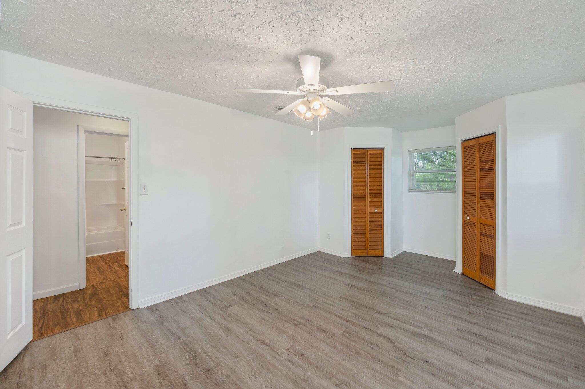 1099 Highway 2 Westville, FL 32464 - Photo 18 of 34 wooden floor in an empty room with a window