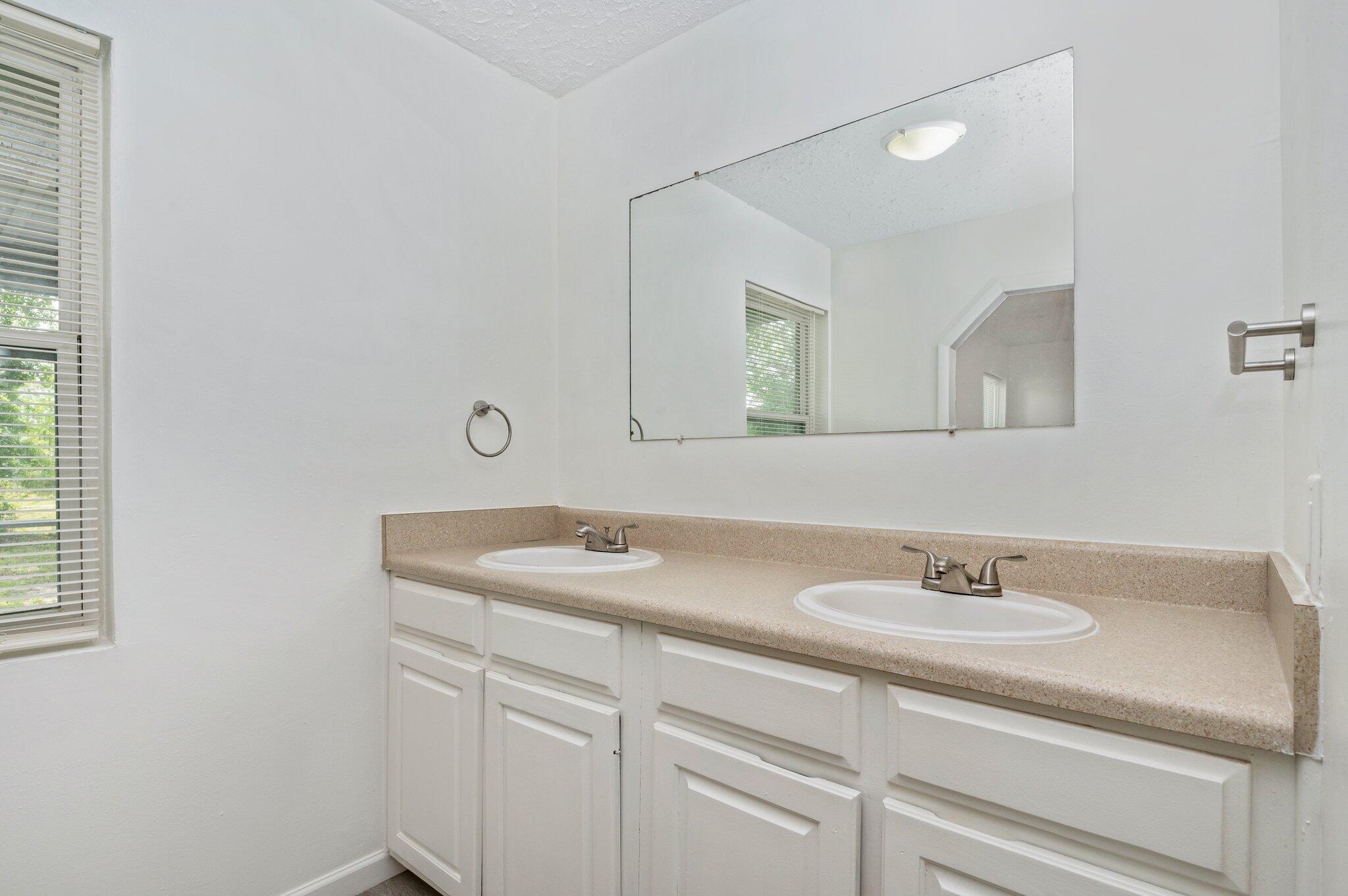 1099 Highway 2 Westville, FL 32464 - Photo 20 of 34 a bathroom with a sink and a mirror
