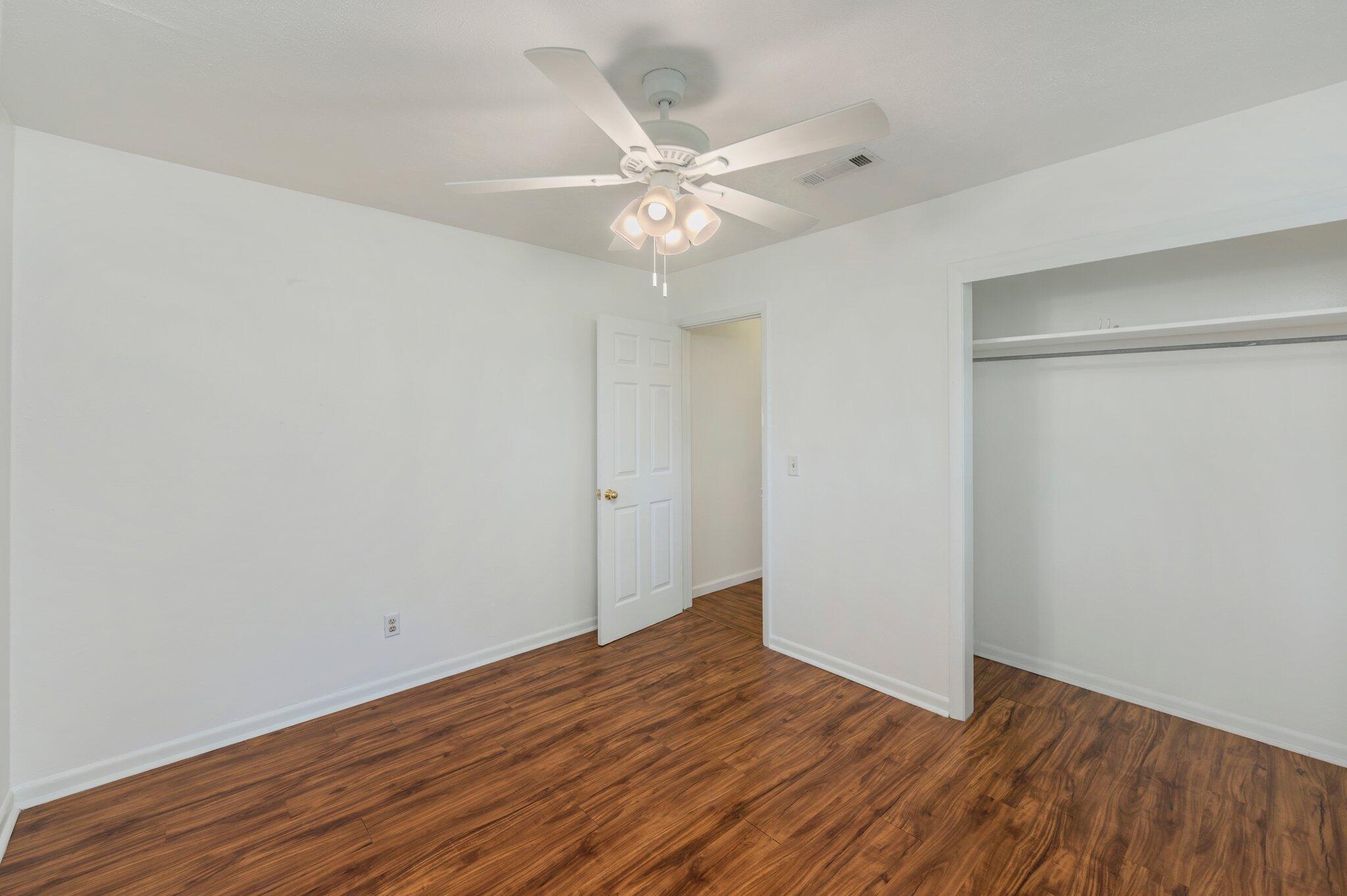 1099 Highway 2 Westville, FL 32464 - Photo 23 of 34 a view of an empty room with wooden floor