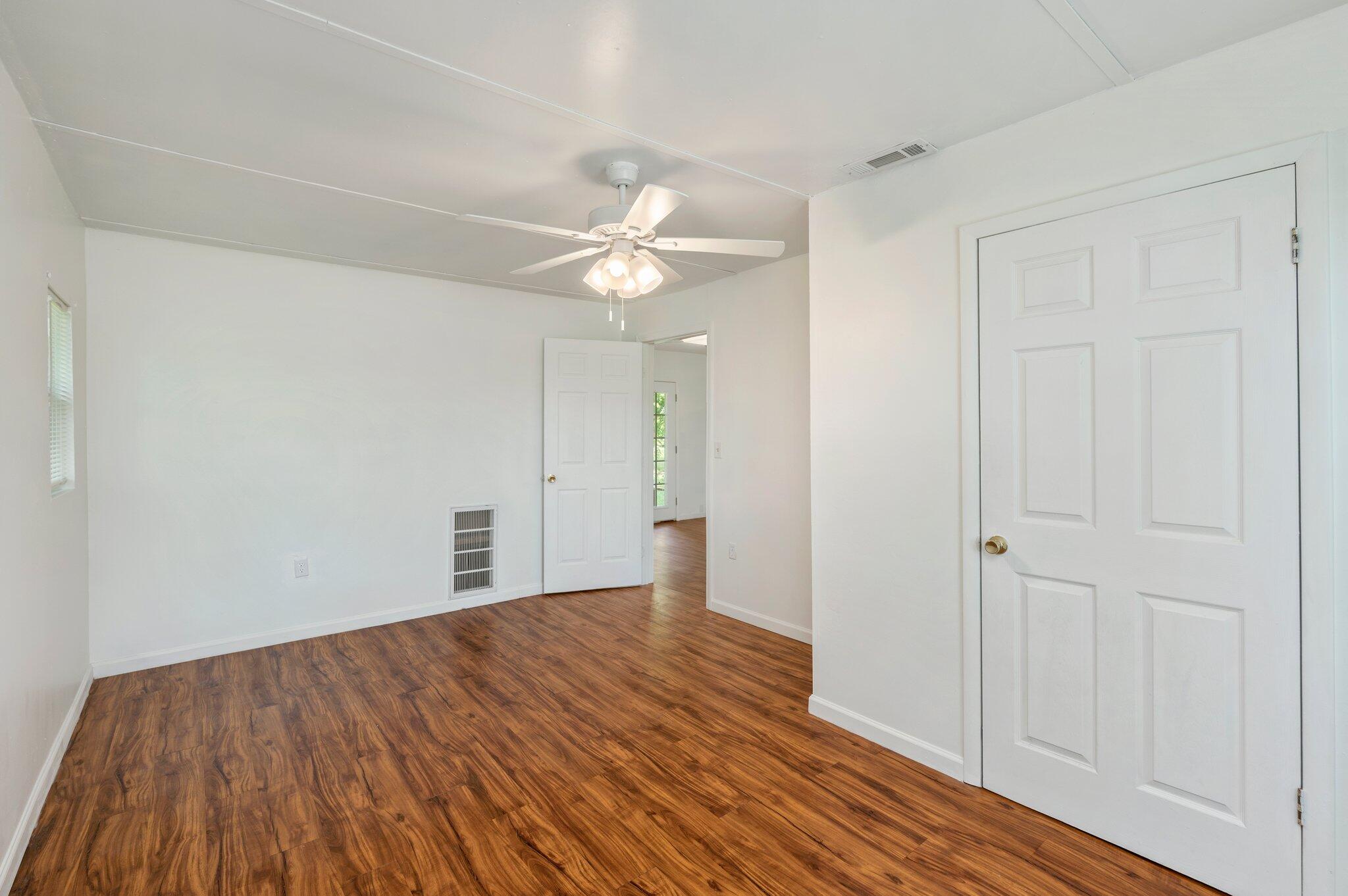 1099 Highway 2 Westville, FL 32464 - Photo 25 of 34 wooden floor in an empty room with a window